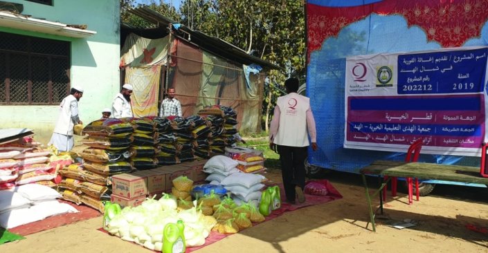 Qatar Charity distributes food baskets to flood victims in India