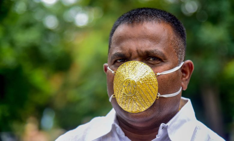 Indian man wears gold face mask to ward off coronavirus Indian man wears gold face mask to ward off coronavirus