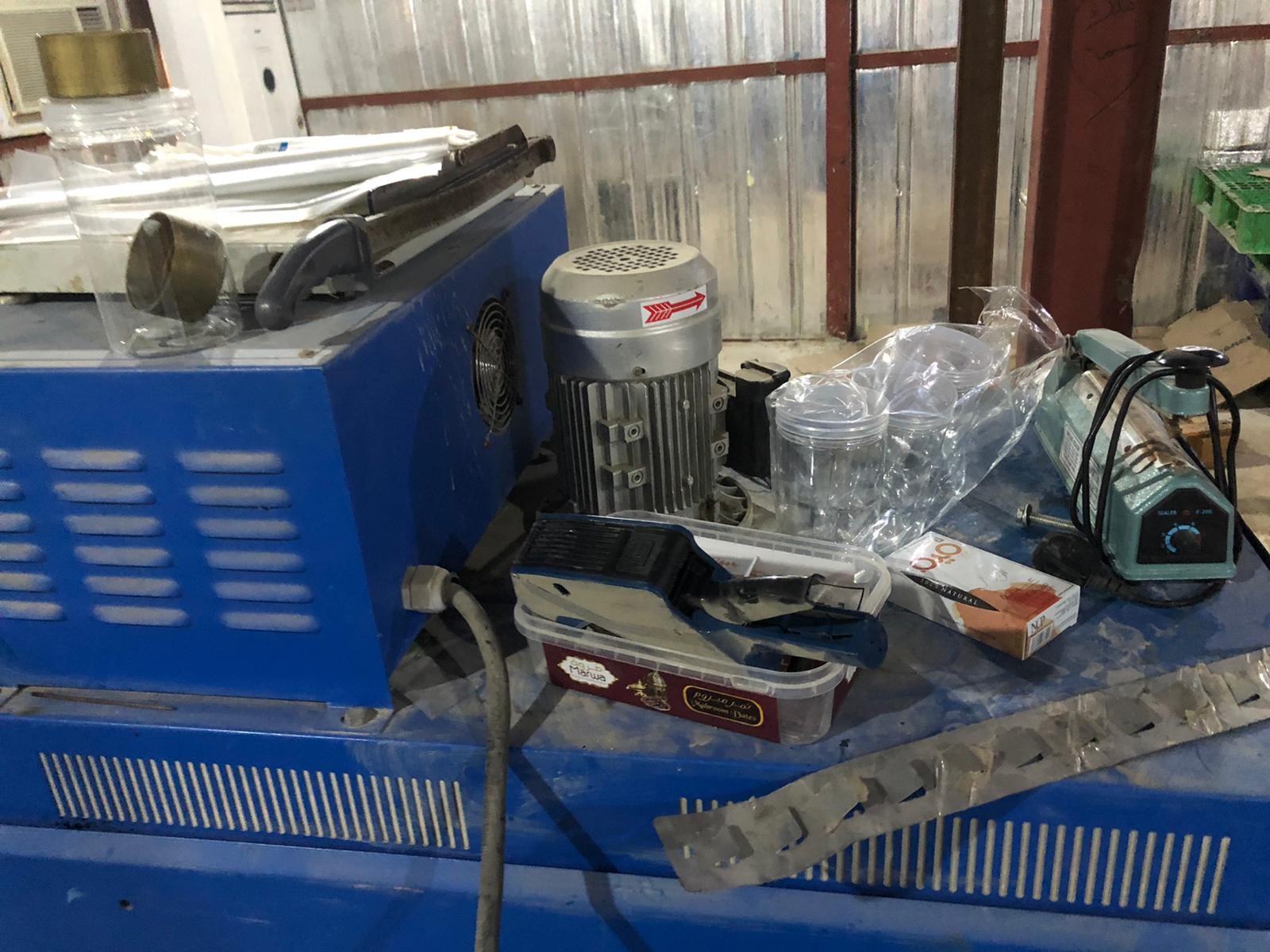 Machinery used to change expiry dates seized from food store