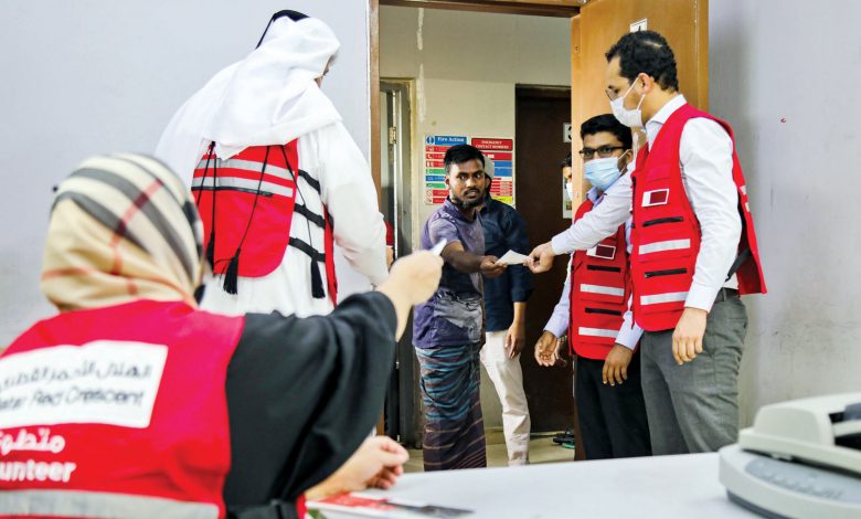 QRCS distributes food coupons to workers QRCS distributes food coupons to workers